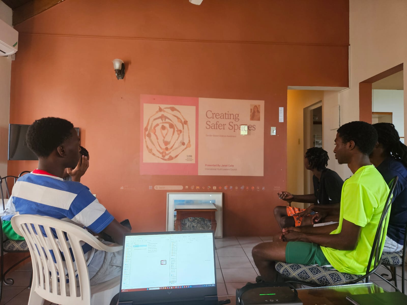 Students in Jamaica with partner YFDN watching a Teen2Teen video on creating safer spaces