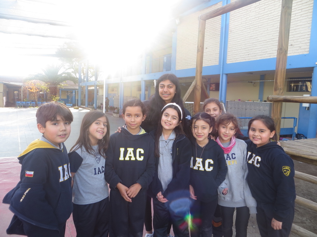 IYLC members with students during a school outreach visit