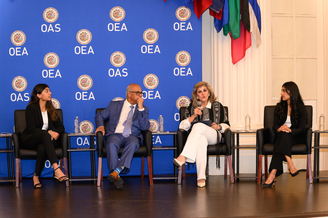 IYLC Executive Director Samaya Shah moderating a panel on the OAS stage in Washington, D.C.