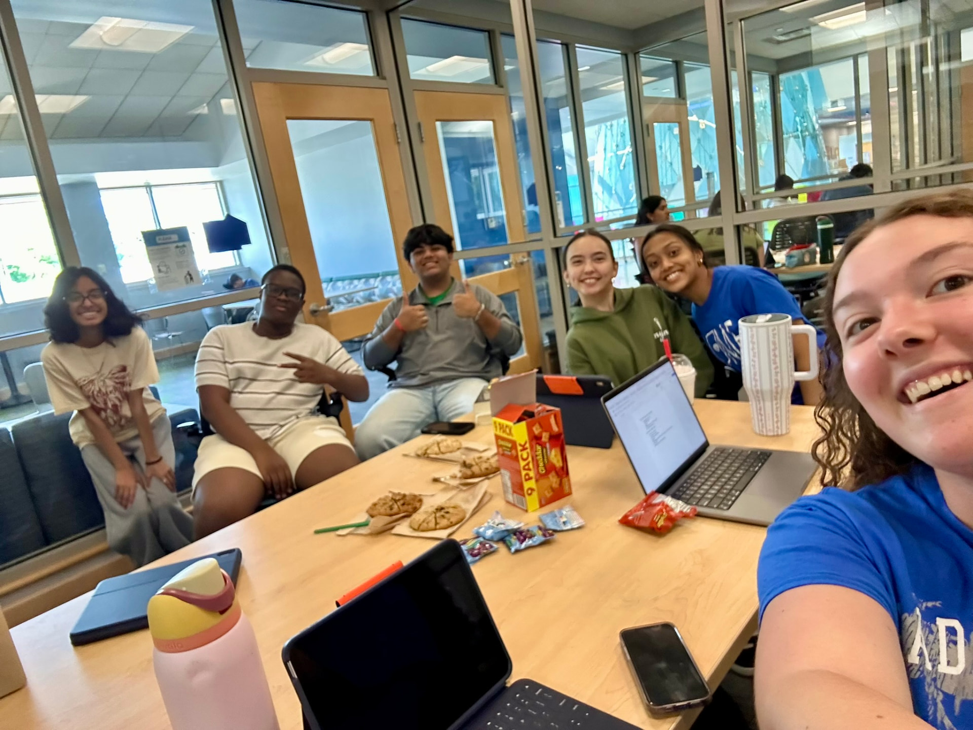 IYLC members gathered around a table for their first chapter meeting
